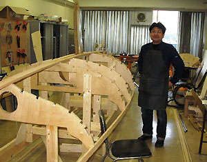 small wooden sailboat building